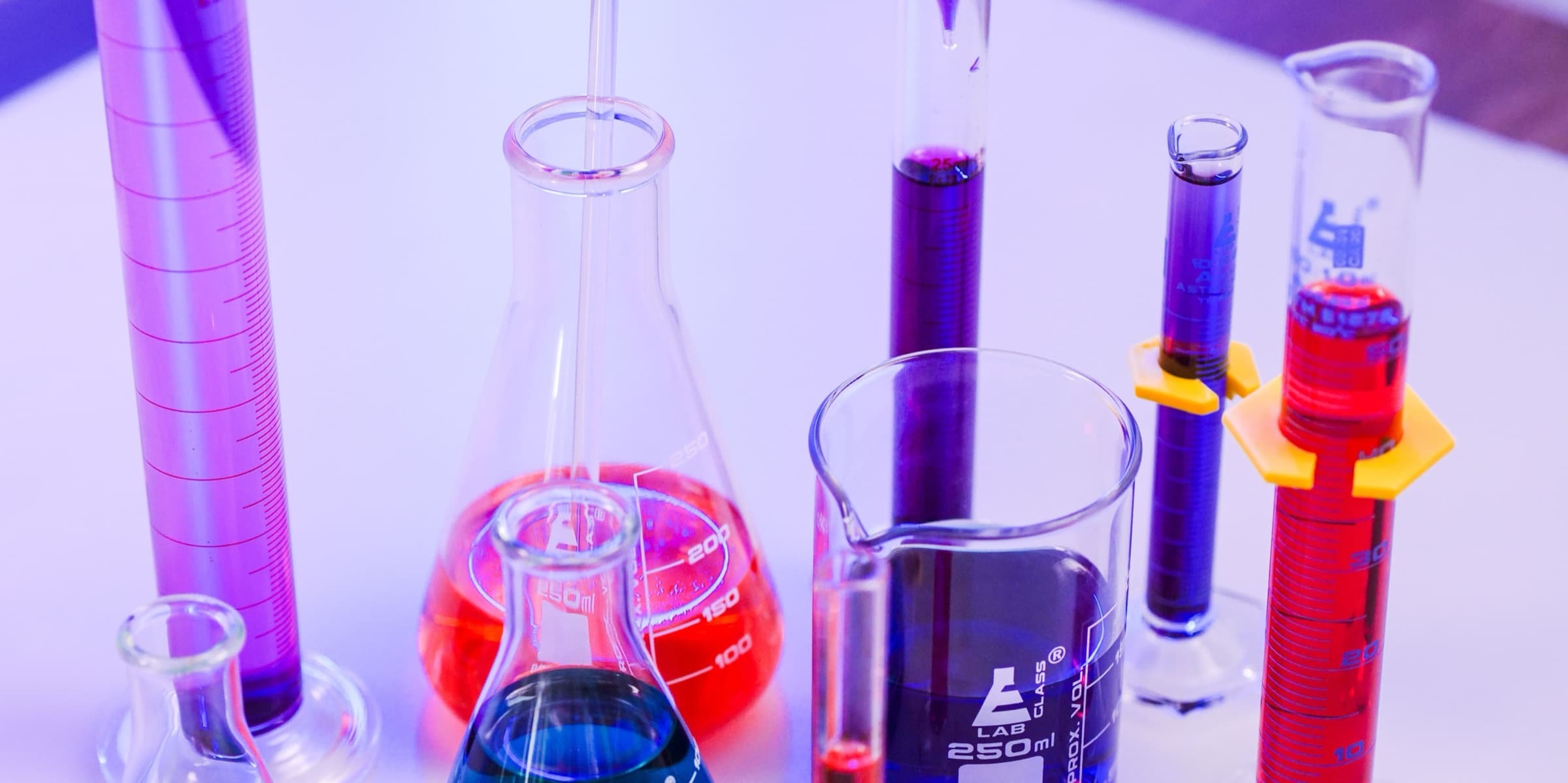 Brightly coloured liquids in laboratory glassware